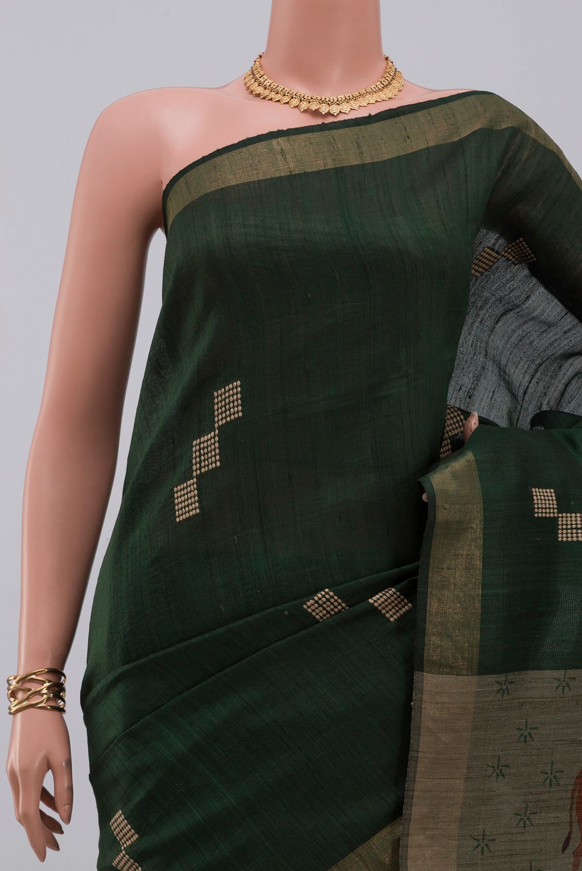 Border image of Green Tussar Silk Saree with Thread Butta on the body and Zari Border. 