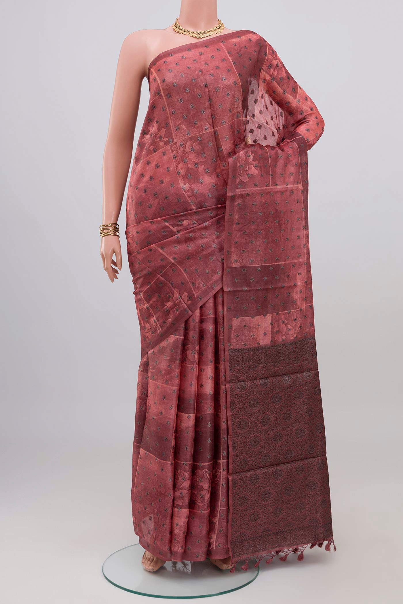 Coral Tussar Silk Saree with Printed design on the body and Without Border.  displayed on a mannequin