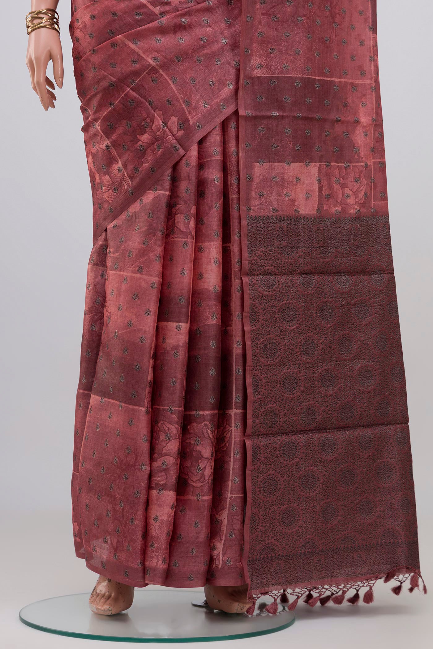 Pleats and pallu of Coral Tussar Silk Saree with Printed design on the body and Without Border. 
