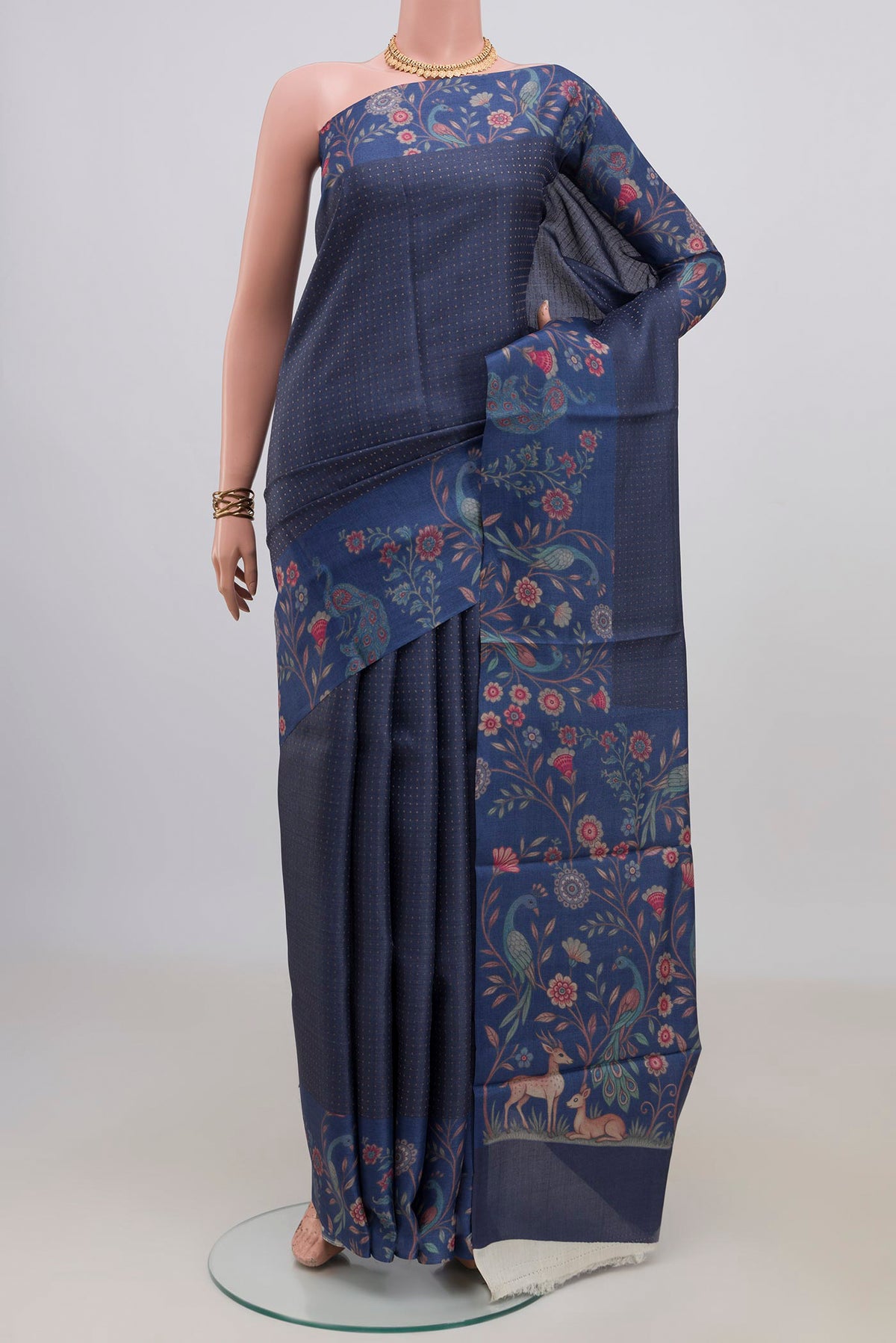Blue Grey Tussar Saree with Checked design on the body and Printed Border.  displayed on a mannequin