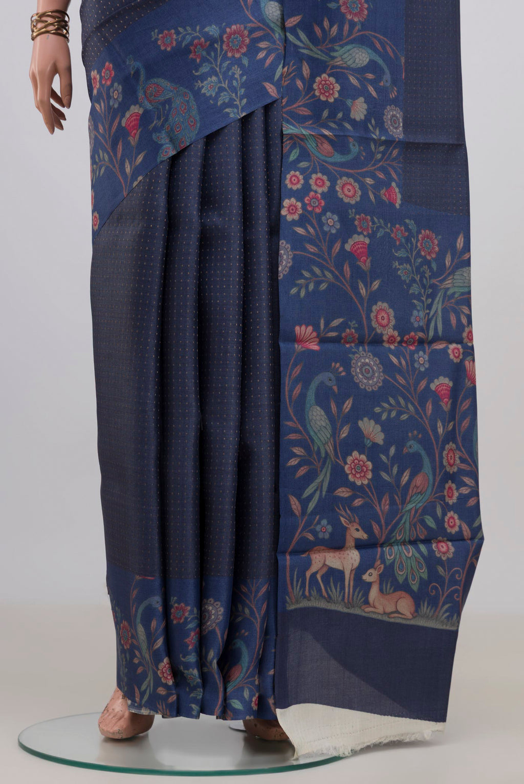 Pleats and pallu of Blue Grey Tussar Saree with Checked design on the body and Printed Border. 