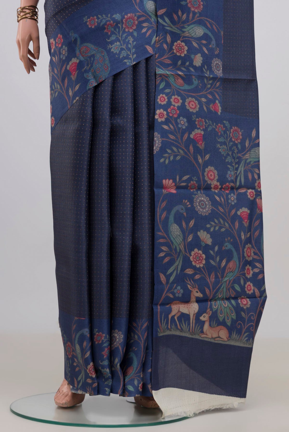 Pleats and pallu of Blue Grey Tussar Saree with Checked design on the body and Printed Border. 