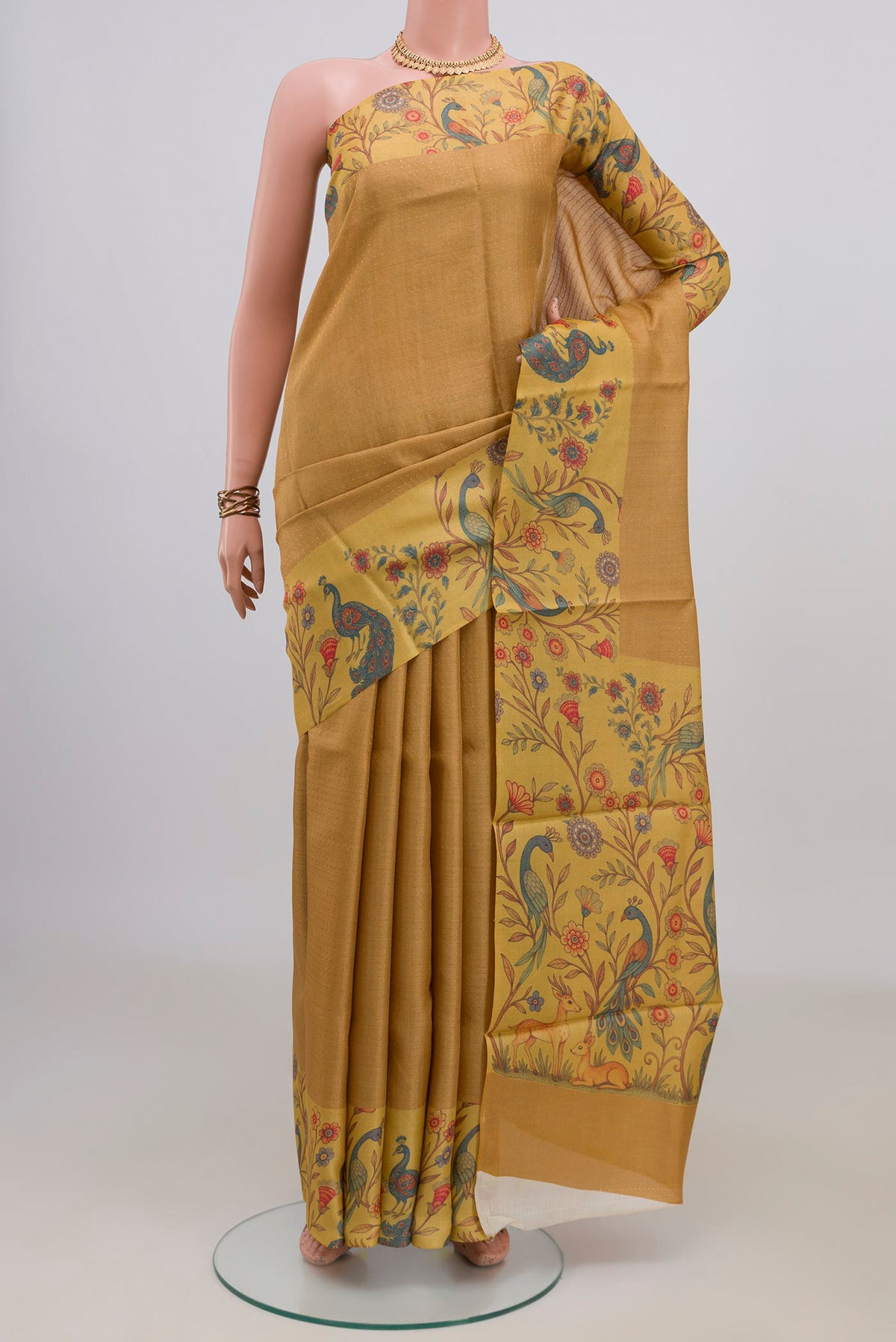 Mustard Tussar Saree with Checked design on the body and Printed Border.  displayed on a mannequin