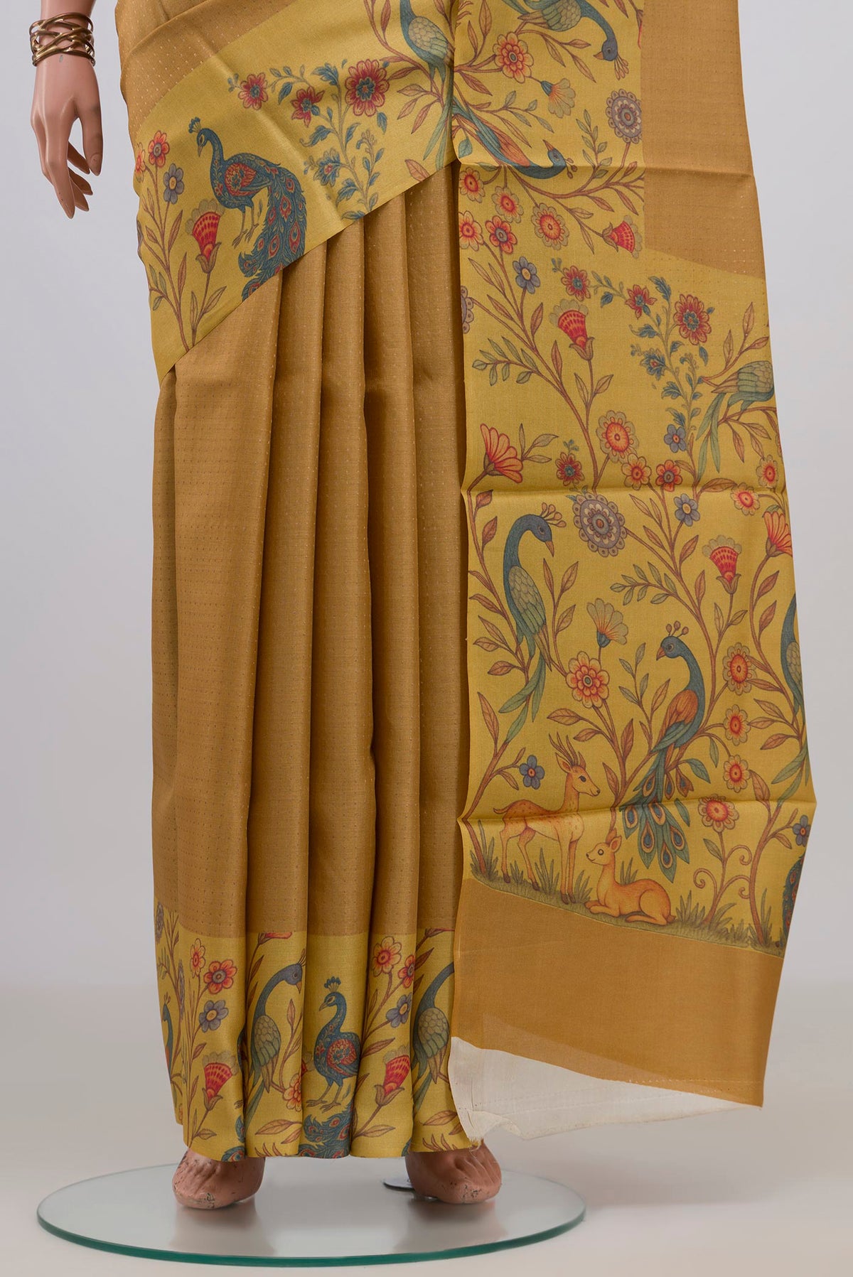 Pleats and pallu of Mustard Tussar Saree with Checked design on the body and Printed Border. 