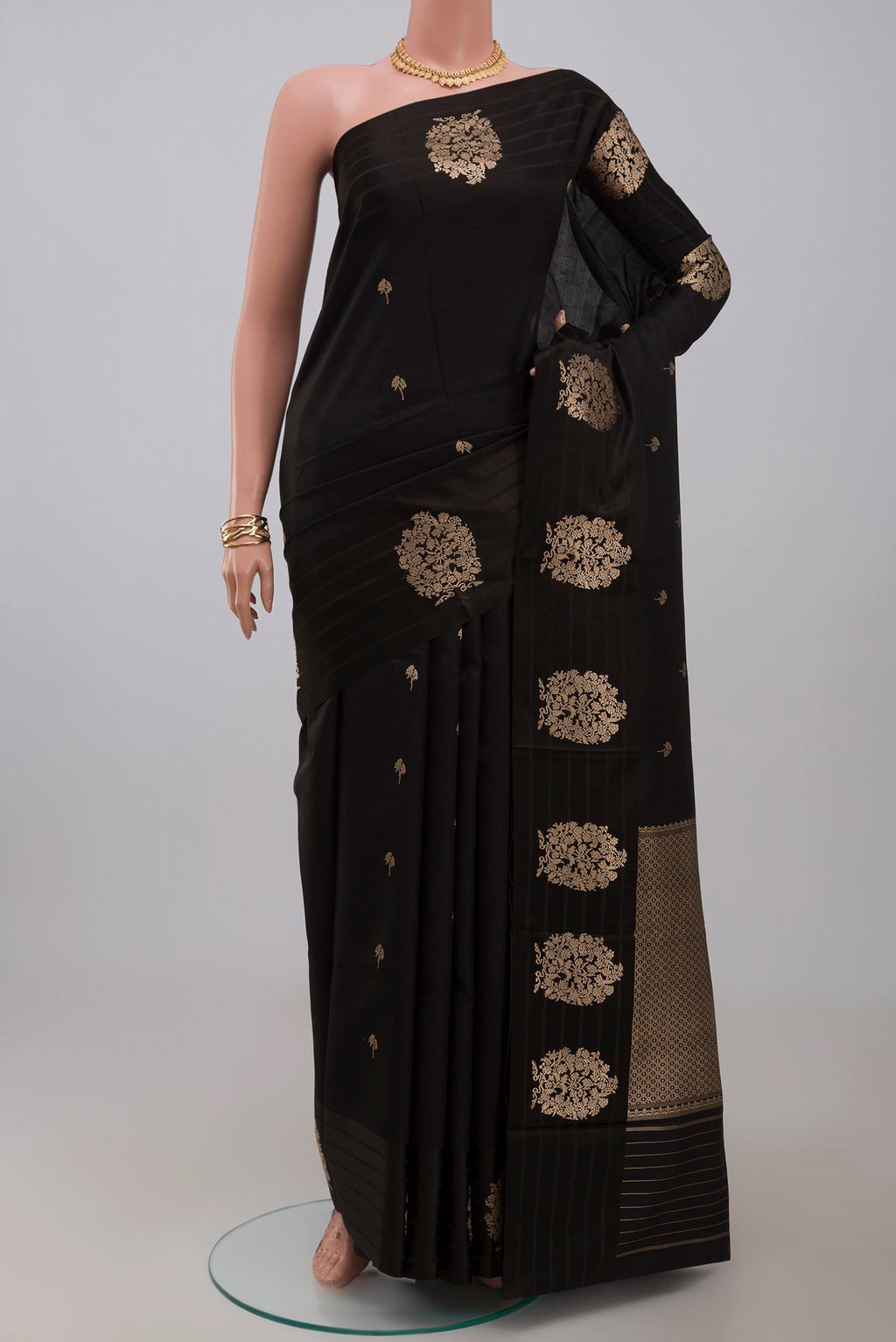 Black Banarasi Katan Silk Saree with Zari Butta on the body and Fancy Border.  displayed on a mannequin