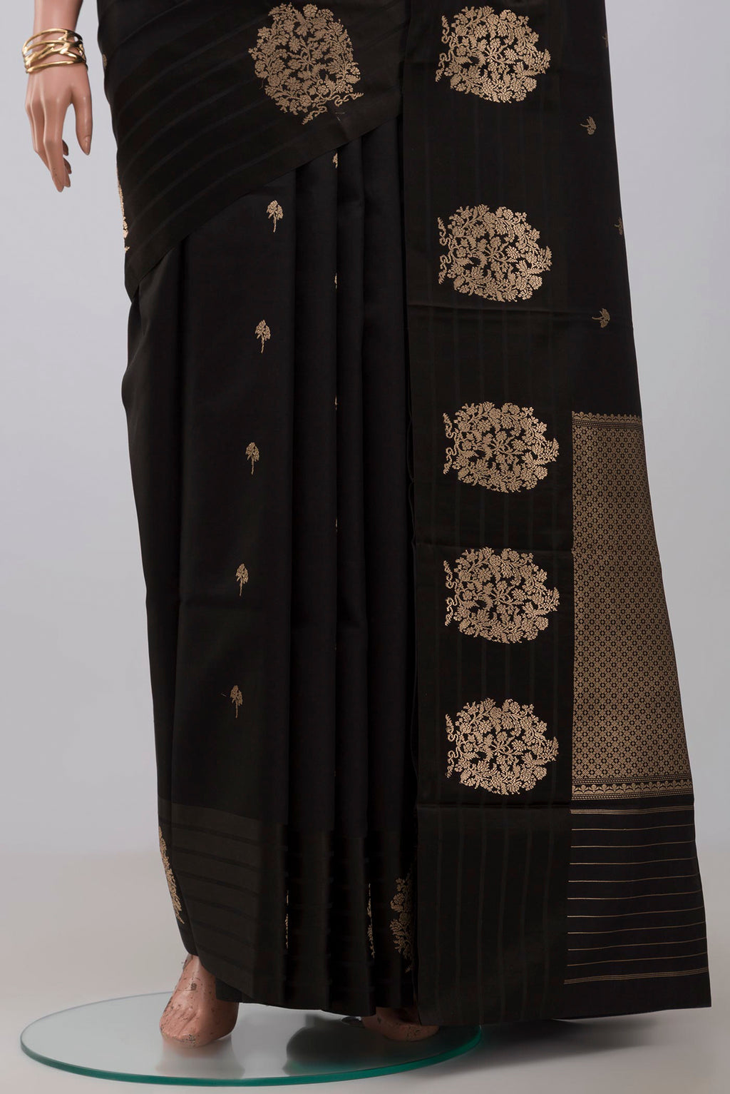 Pleats and pallu of Black Banarasi Katan Silk Saree with Zari Butta on the body and Fancy Border. 