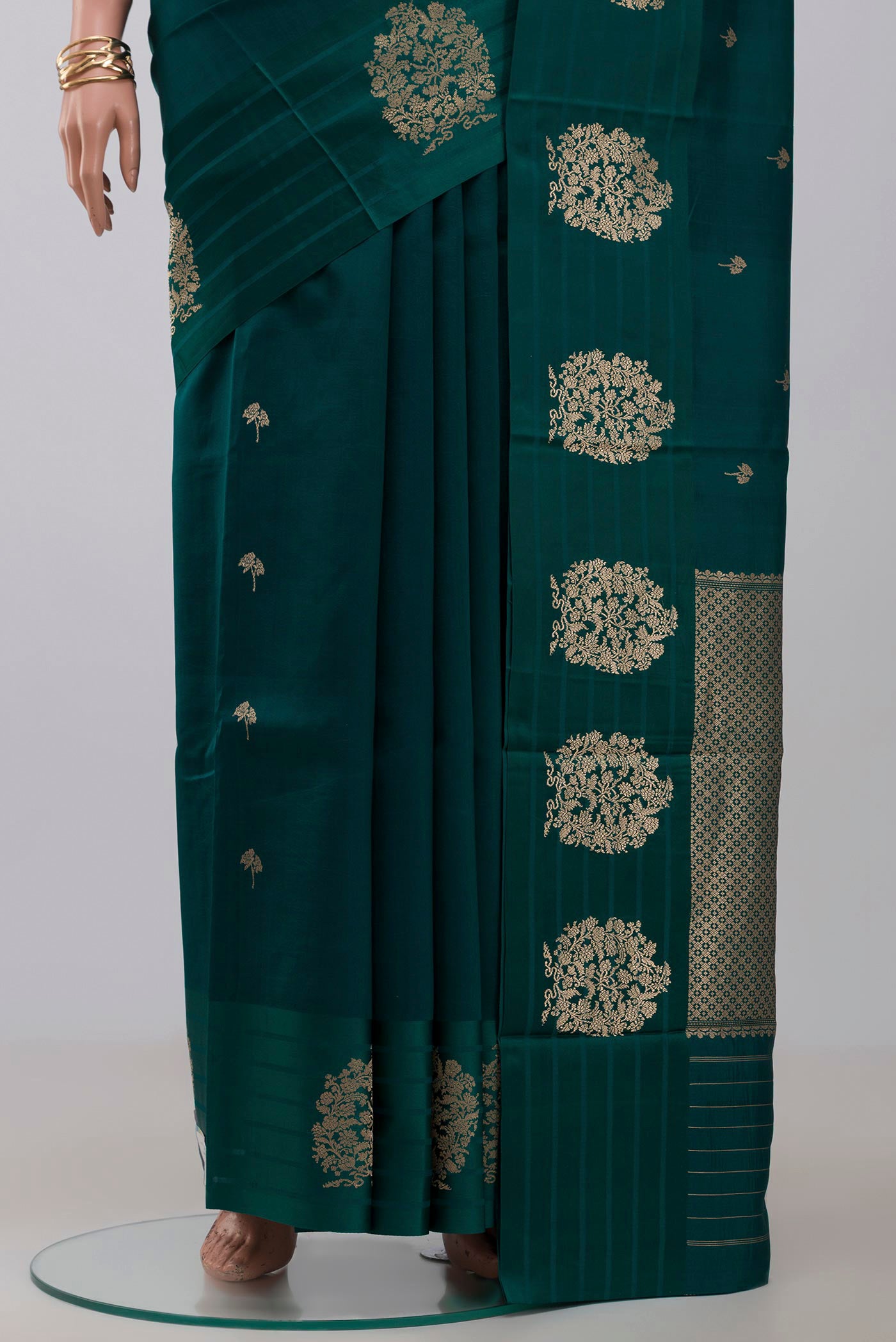 Pleats and pallu of Green Banarasi Katan Silk Saree with Zari Butta on the body and Fancy Border. 