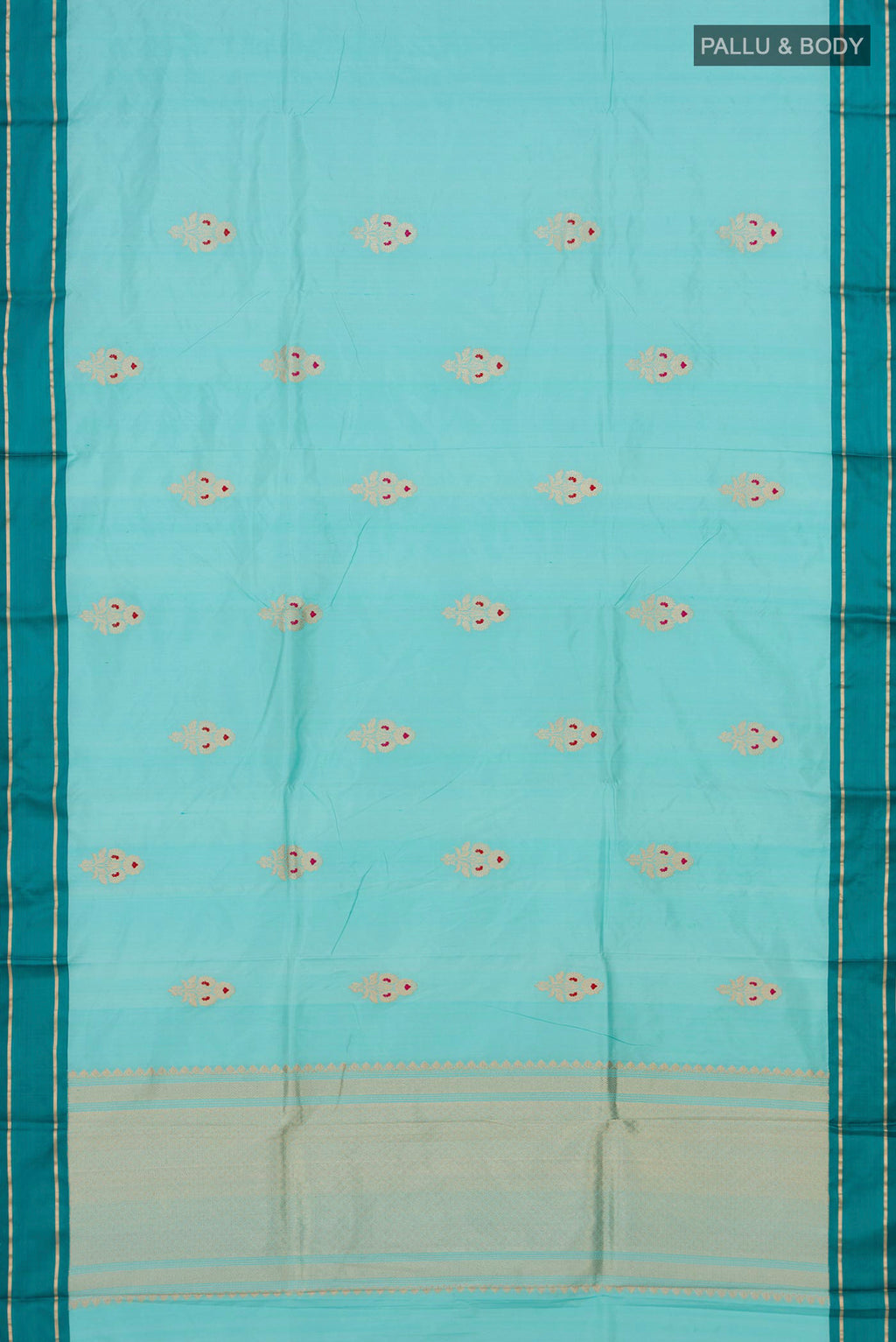 Flat view of Sky Blue Banarasi Katan Silk Saree with Zari Butta on the body and Plain Border. 