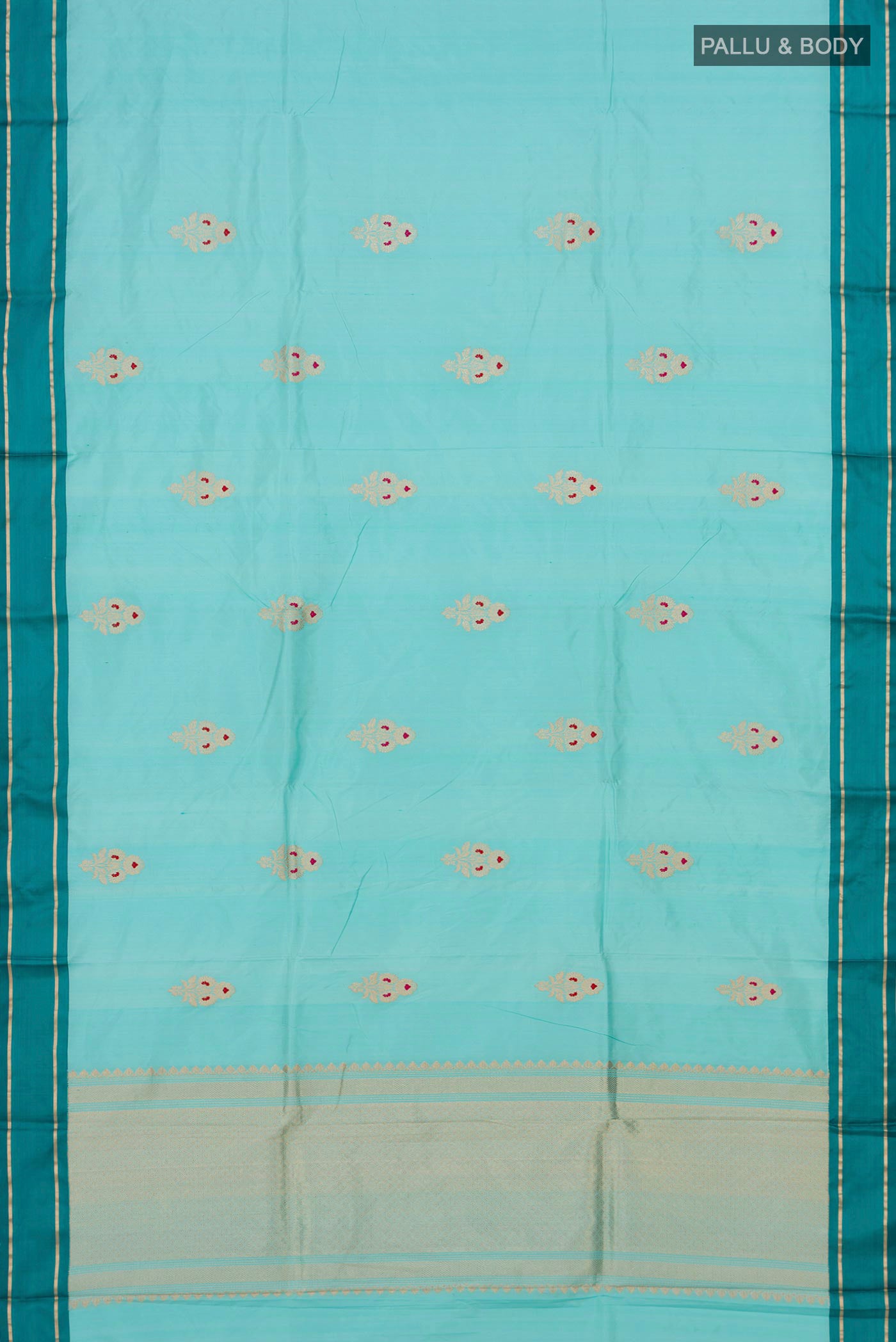 Flat view of Sky Blue Banarasi Katan Silk Saree with Zari Butta on the body and Plain Border. 