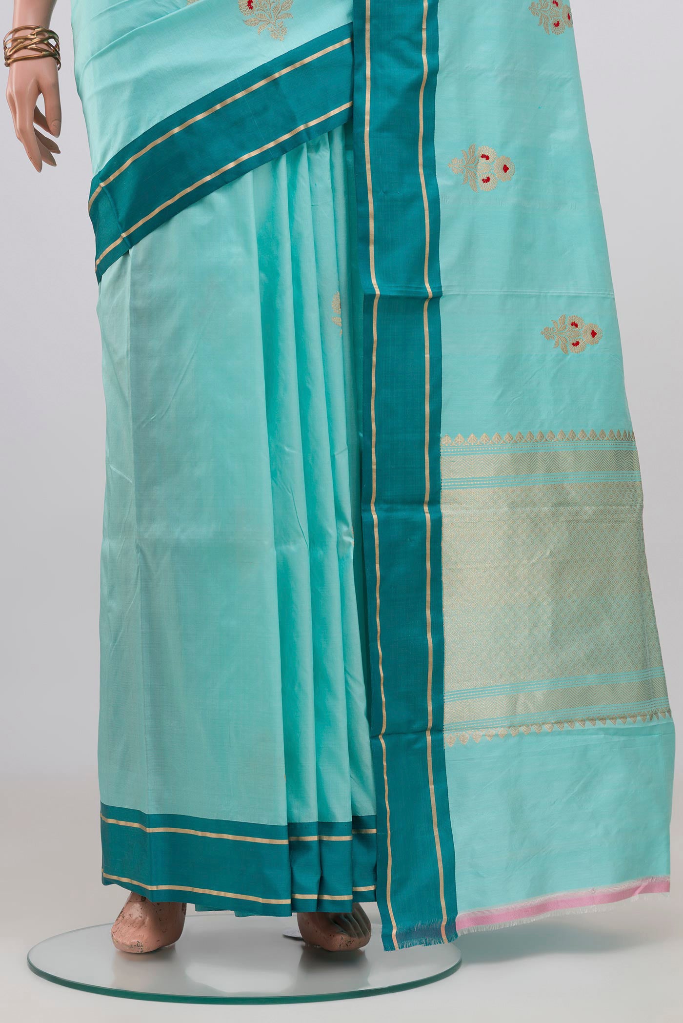 Pleats and pallu of Sky Blue Banarasi Katan Silk Saree with Zari Butta on the body and Plain Border. 