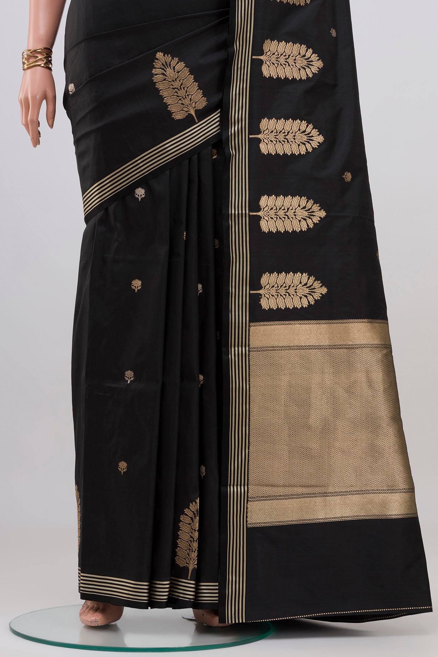 Pleats and pallu of Black Banarasi Katan Silk Saree with Zari Butta on the body and Zari Border. 