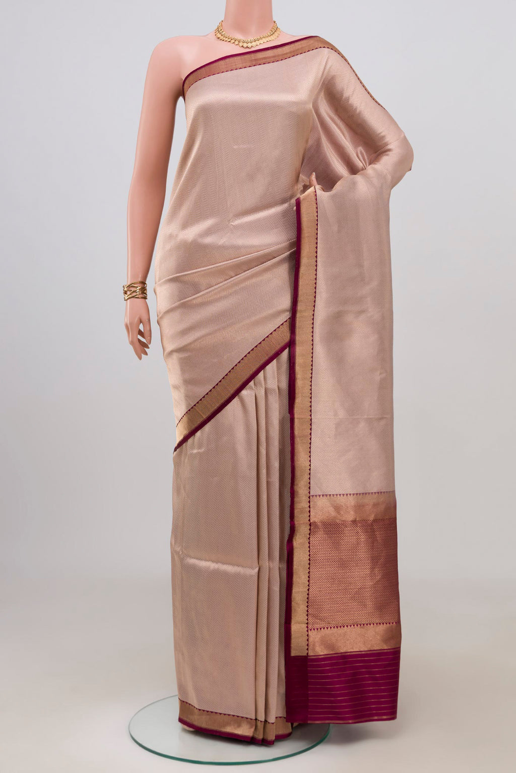 Rose Gold Banarasi Katan Silk Saree with Zari Brocade on the body and Zari Border.  displayed on a mannequin