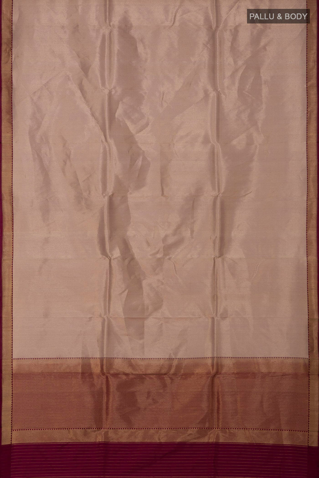 Flat view of Rose Gold Banarasi Katan Silk Saree with Zari Brocade on the body and Zari Border. 