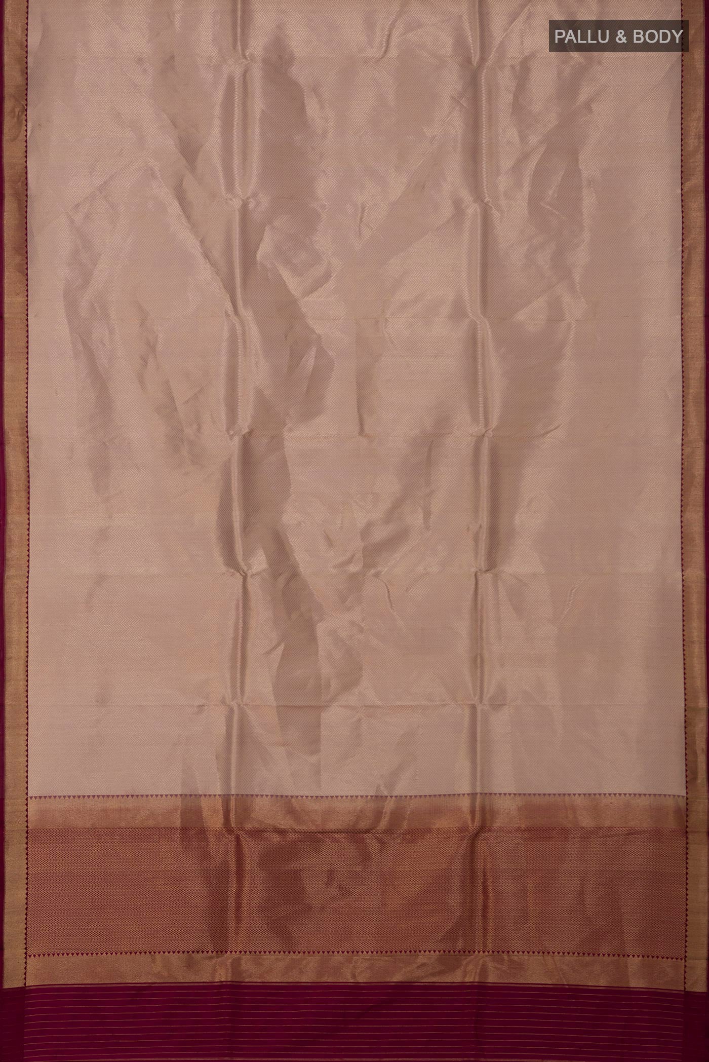 Flat view of Rose Gold Banarasi Katan Silk Saree with Zari Brocade on the body and Zari Border. 