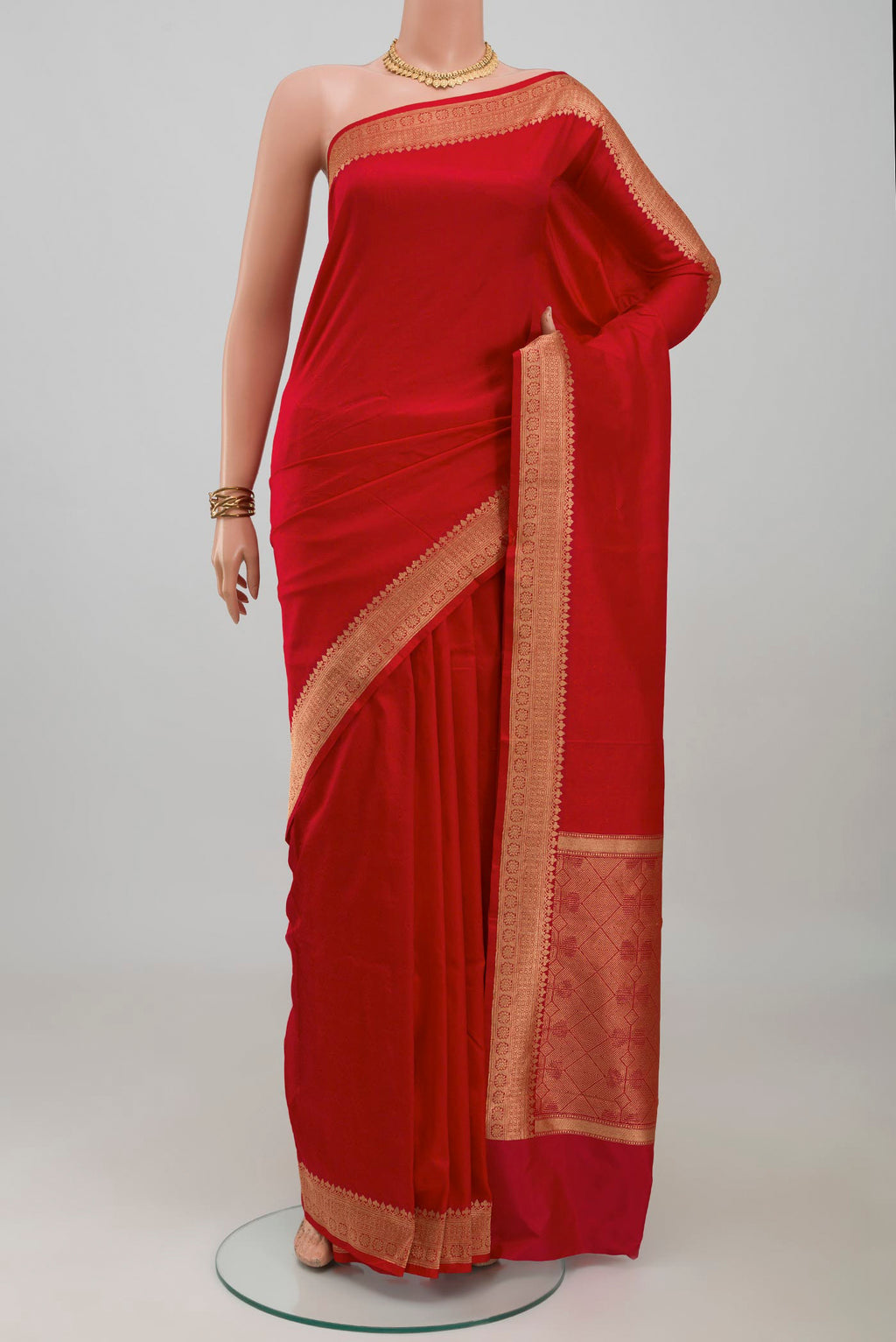 Red Banarasi Katan Silk Saree with Jacquard design on the body and Zari Border.  displayed on a mannequin