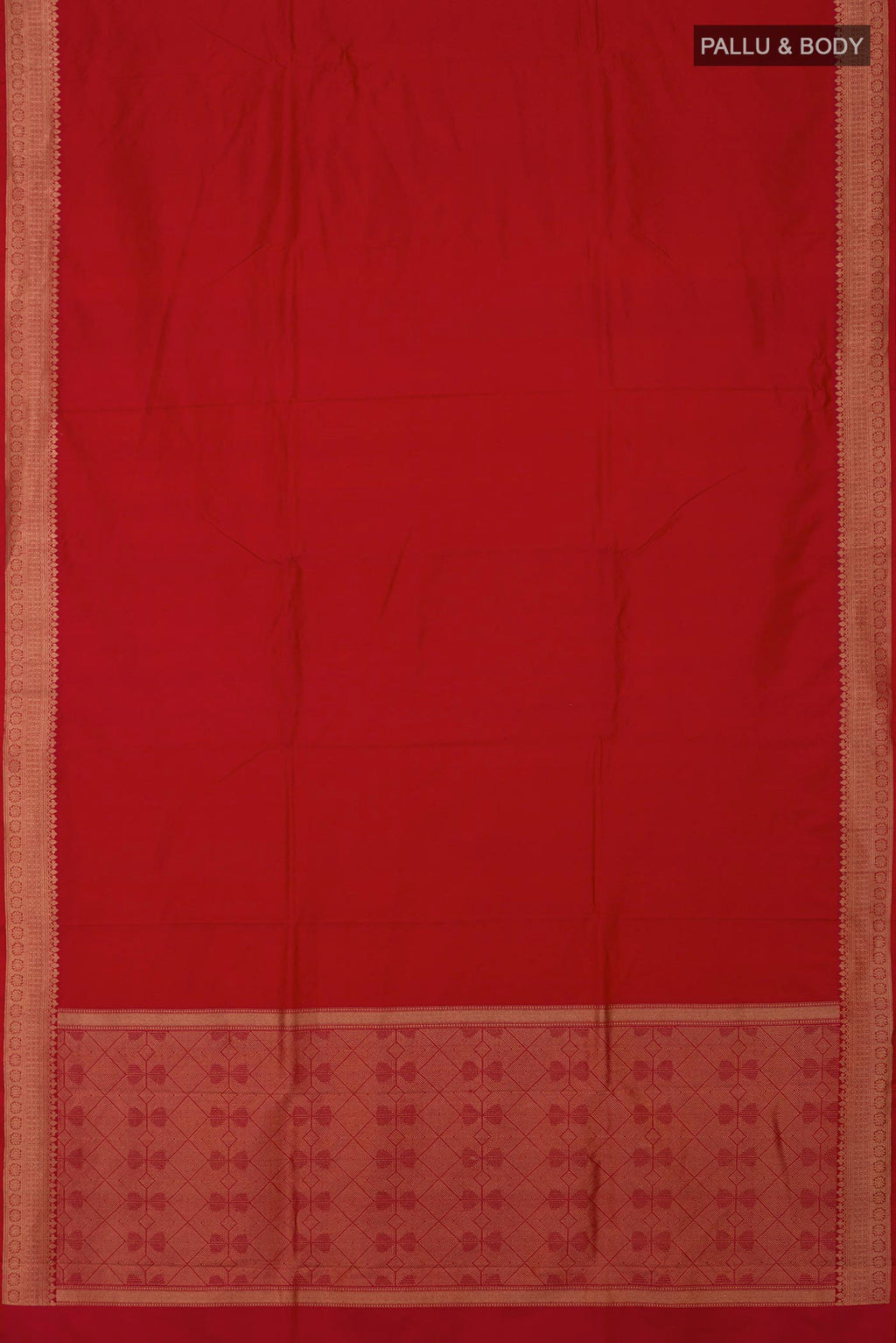 Flat view of Red Banarasi Katan Silk Saree with Jacquard design on the body and Zari Border. 