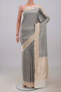 Cream Banarasi Katan Silk Saree with Jacquard design on the body and Zari Border.  displayed on a mannequin
