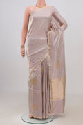 Lavender Banarasi Katan Silk Saree with Zari Butta on the body and Thin Zari Line.  displayed on a mannequin