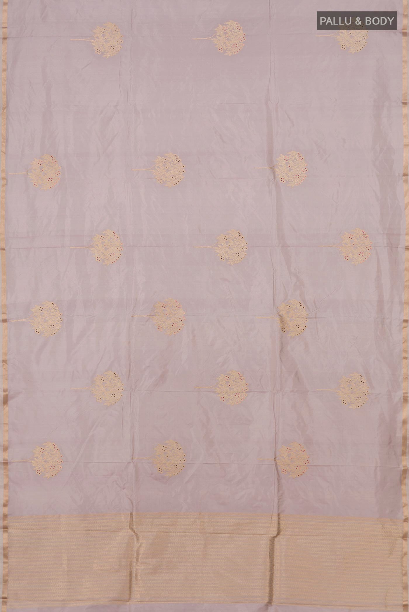 Flat view of Lavender Banarasi Katan Silk Saree with Zari Butta on the body and Thin Zari Line. 