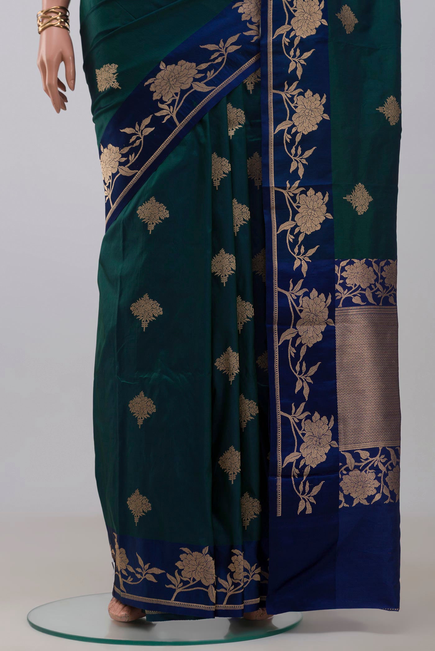 Pleats and pallu of Peacock Blue Banarasi Katan Silk Saree with Zari Butta on the body and Fancy Border. 