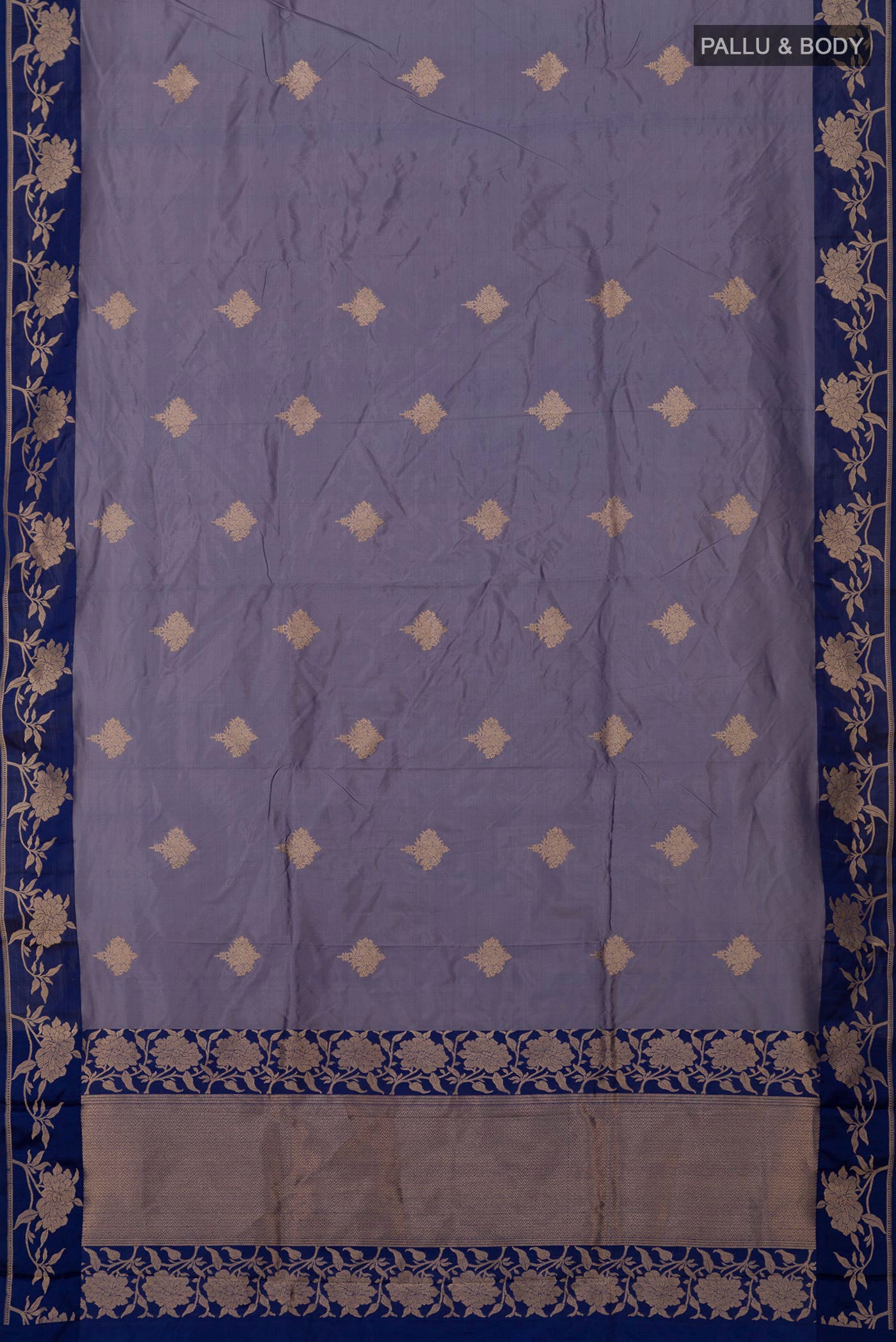 Flat view of Blue Grey Banarasi Katan Silk Saree with Zari Butta on the body and Fancy Border. 
