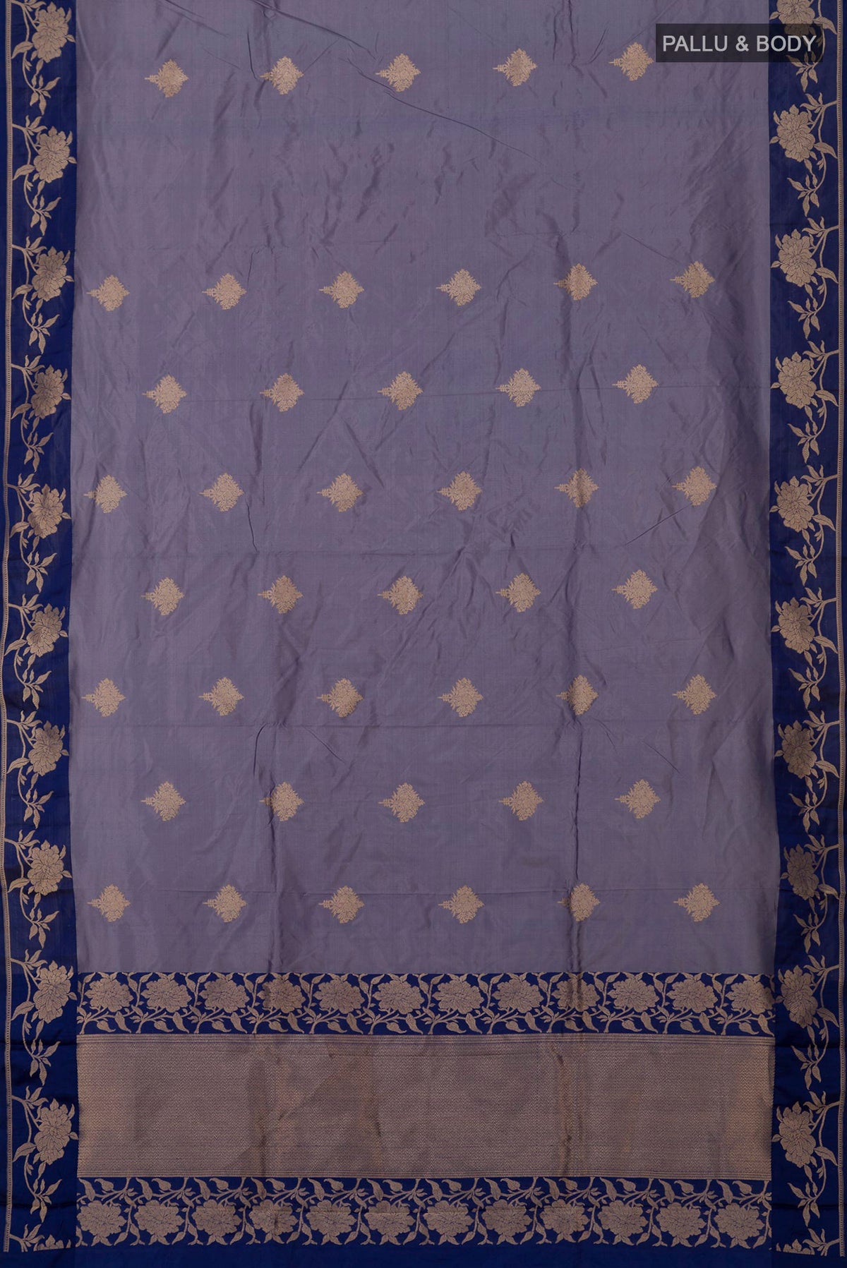 Flat view of Blue Grey Banarasi Katan Silk Saree with Zari Butta on the body and Fancy Border. 