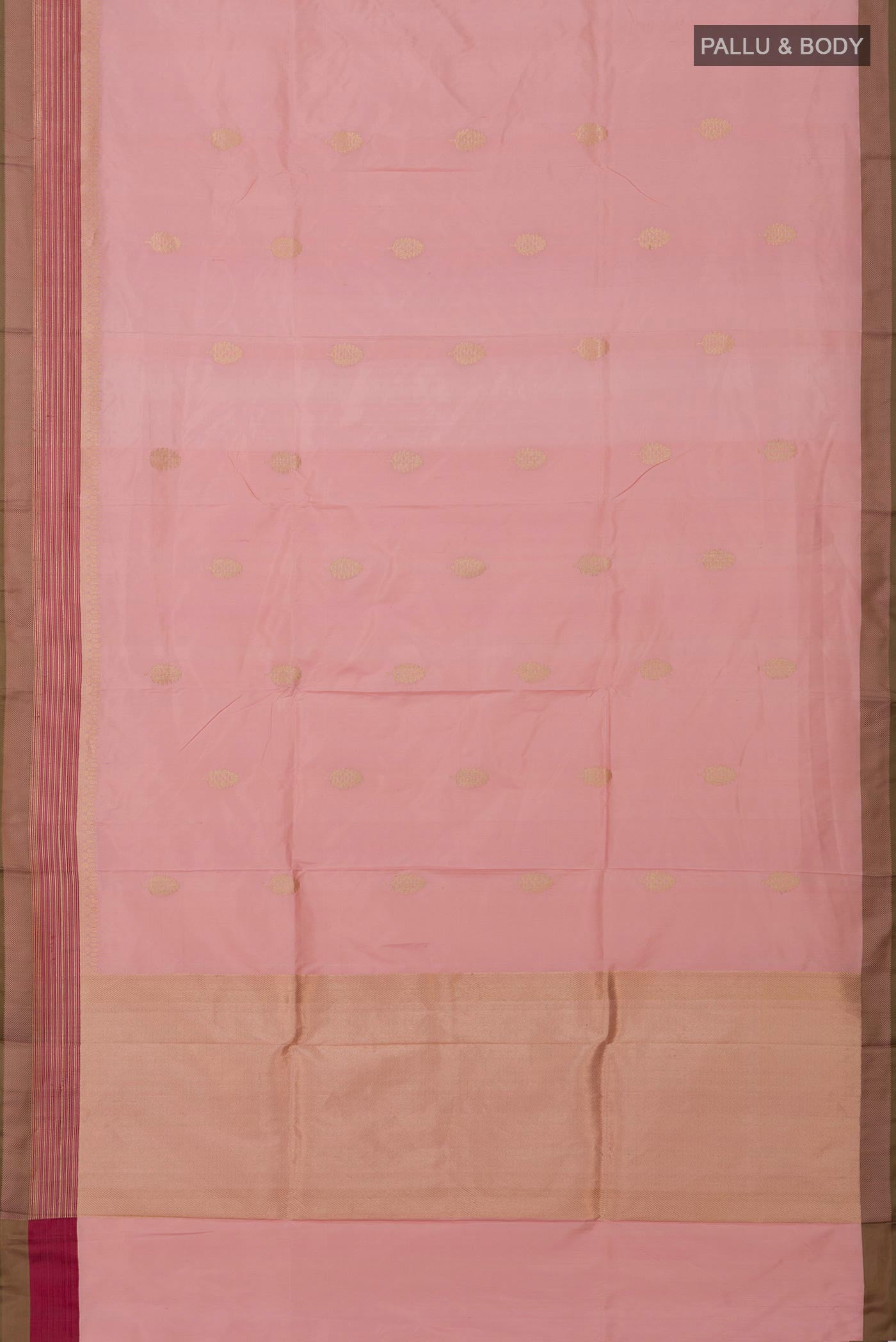 Flat view of Rose Gold Banarasi Katan Silk Saree with Zari Butta on the body and Fancy Border. 