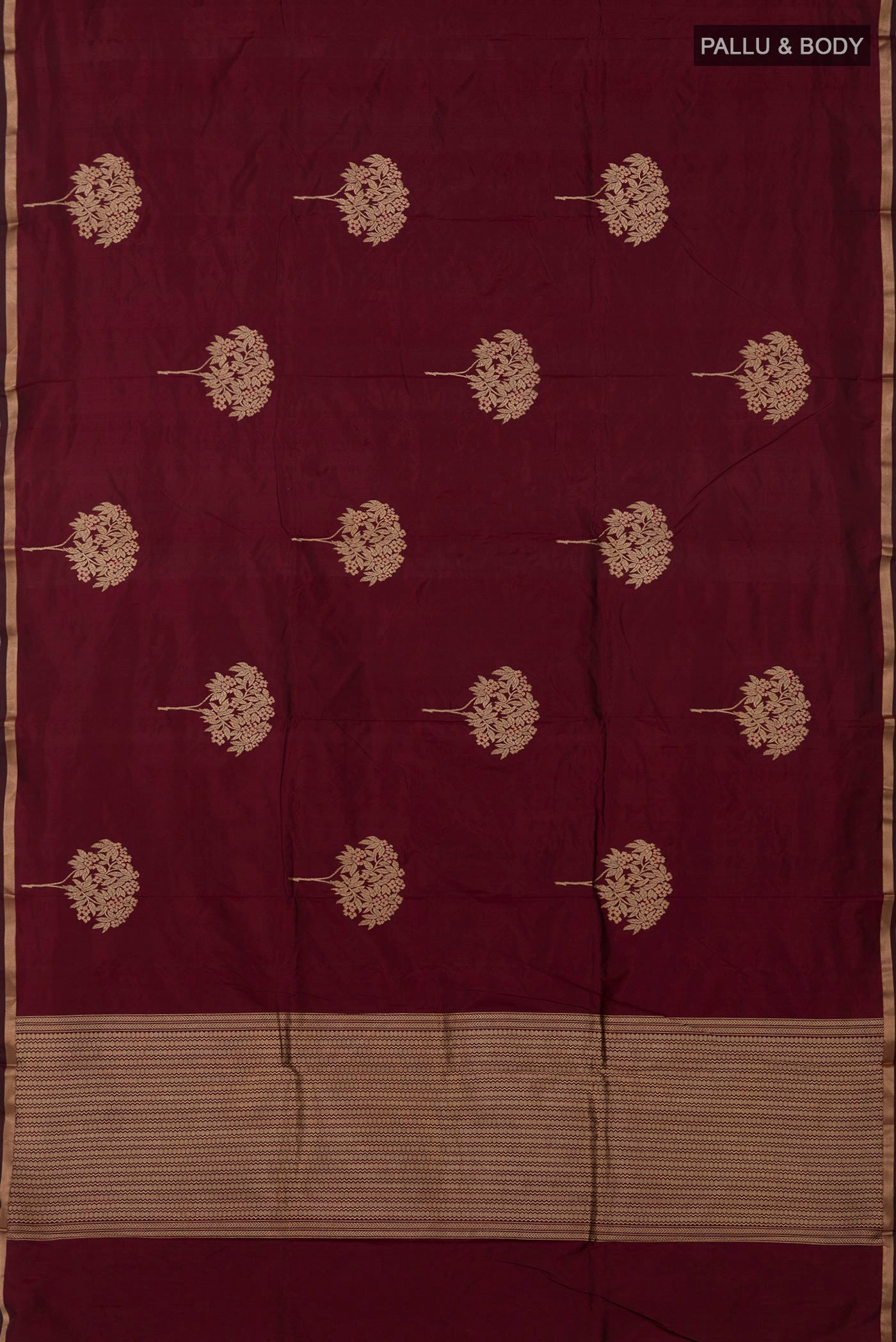 Flat view of Maroon Banarasi Katan Silk Saree with Zari Butta on the body and Thin Zari Line. 