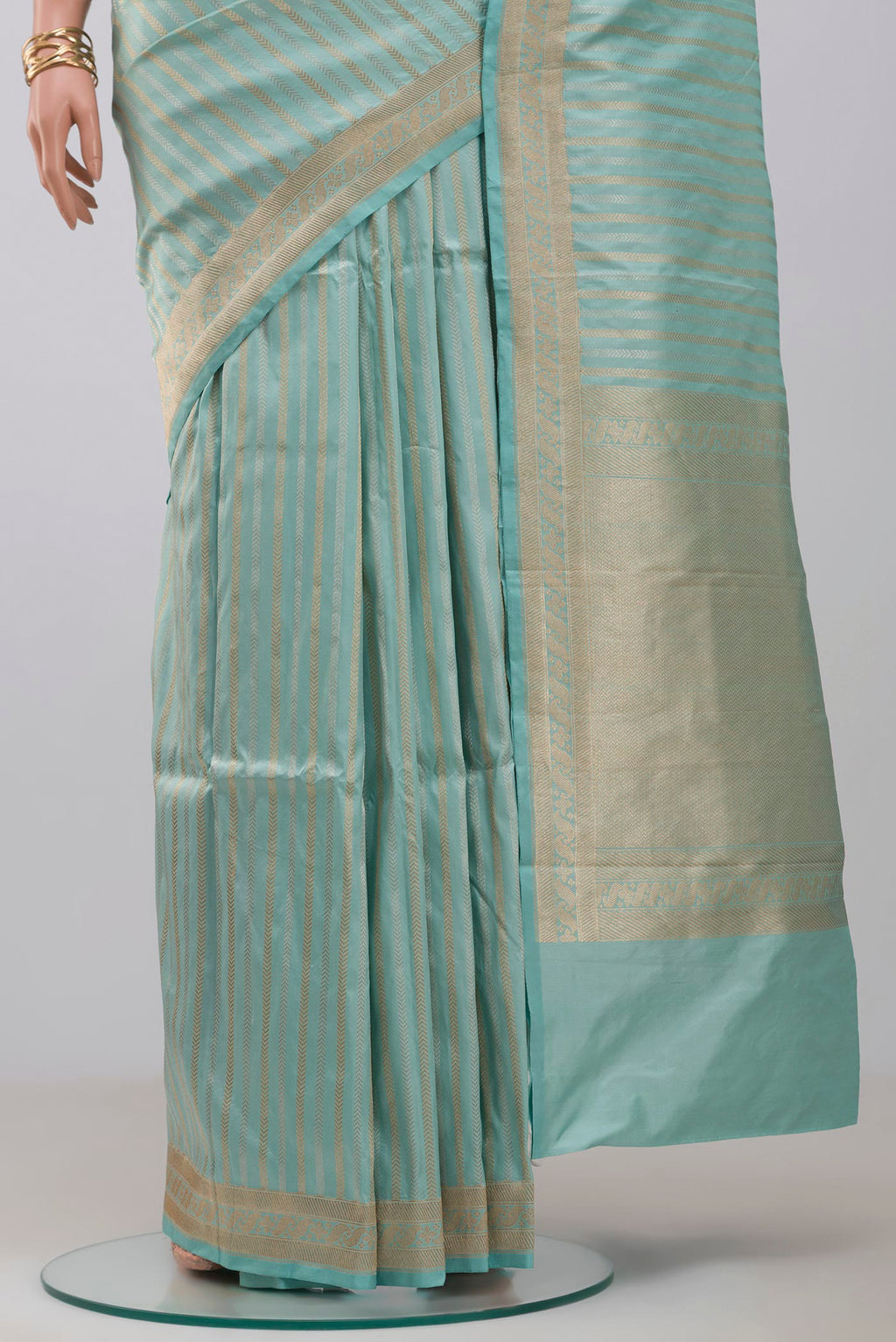 Pleats and pallu of Sky Blue Banarasi Katan Silk Saree with Stripes on the body and Fancy Border. 