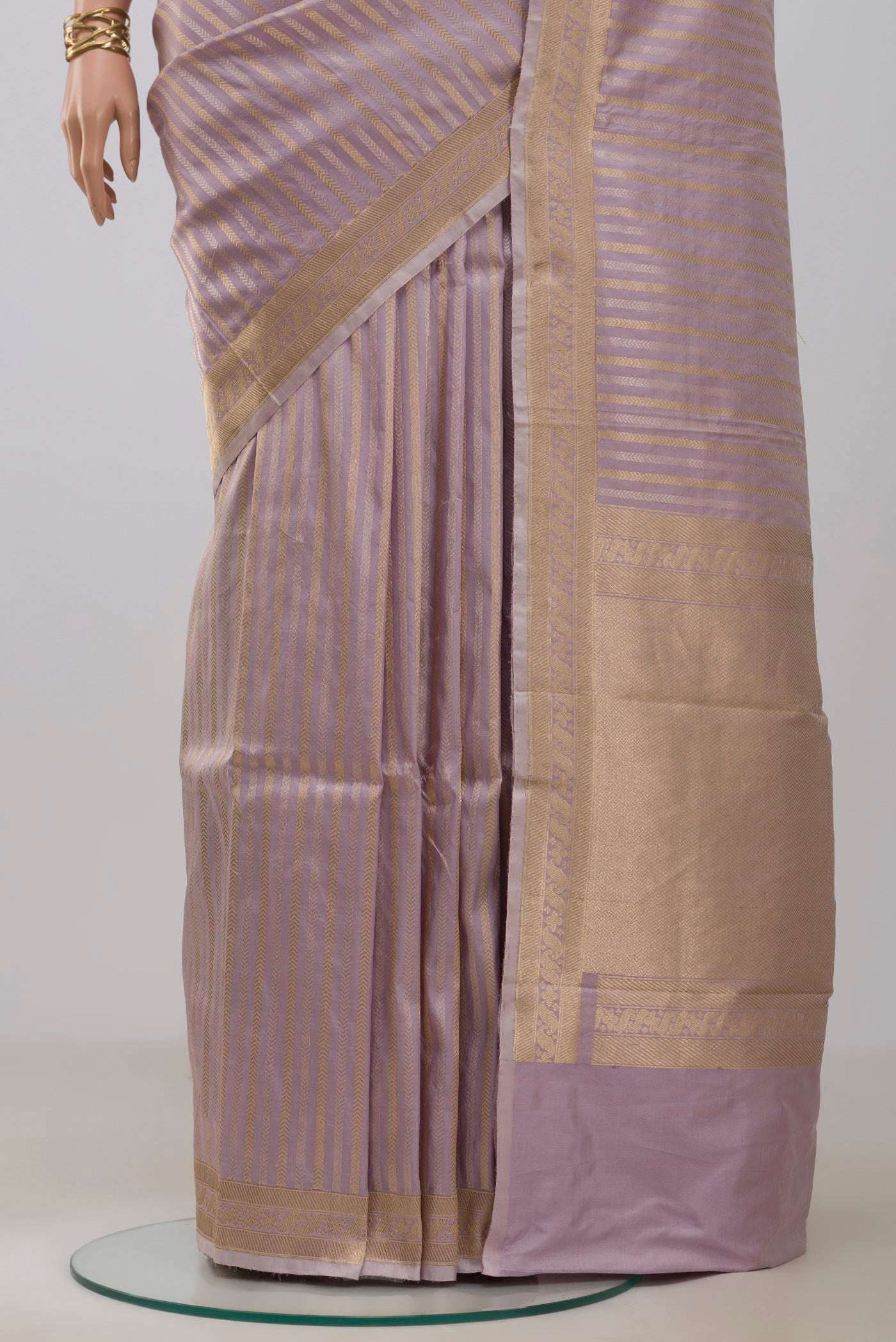 Pleats and pallu of Lavender Banarasi Katan Silk Saree with Stripes on the body and Zari Border. 