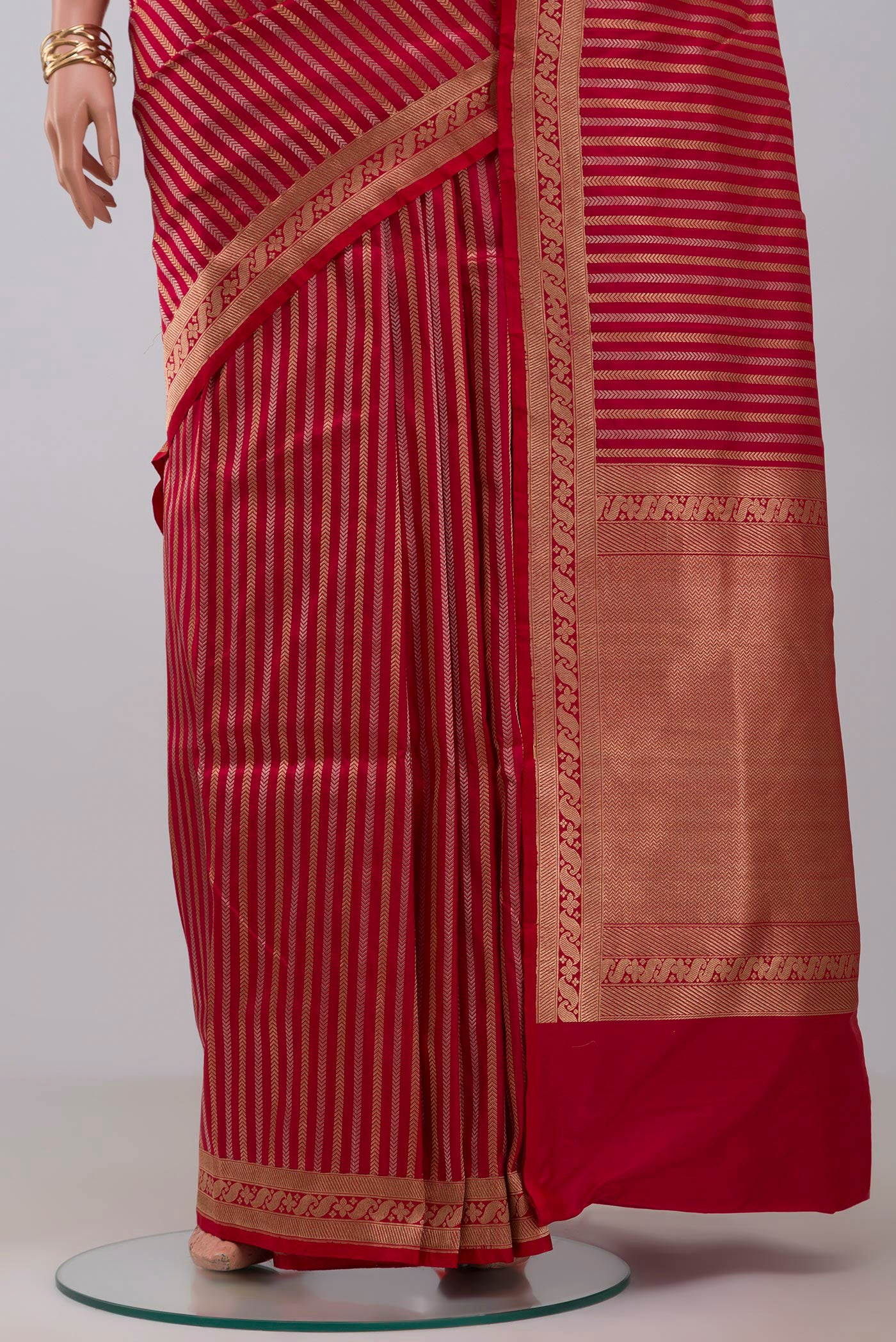 Pleats and pallu of Red Banarasi Katan Silk Saree with Stripes on the body and Fancy Border. 