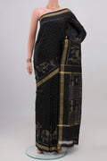 Black Pochampally Silk Saree with Ikat design on the body and Thin Zari Line.  displayed on a mannequin