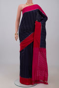 Navy Blue Pochampally Silk Saree with Ikat design on the body and Plain Border.  displayed on a mannequin