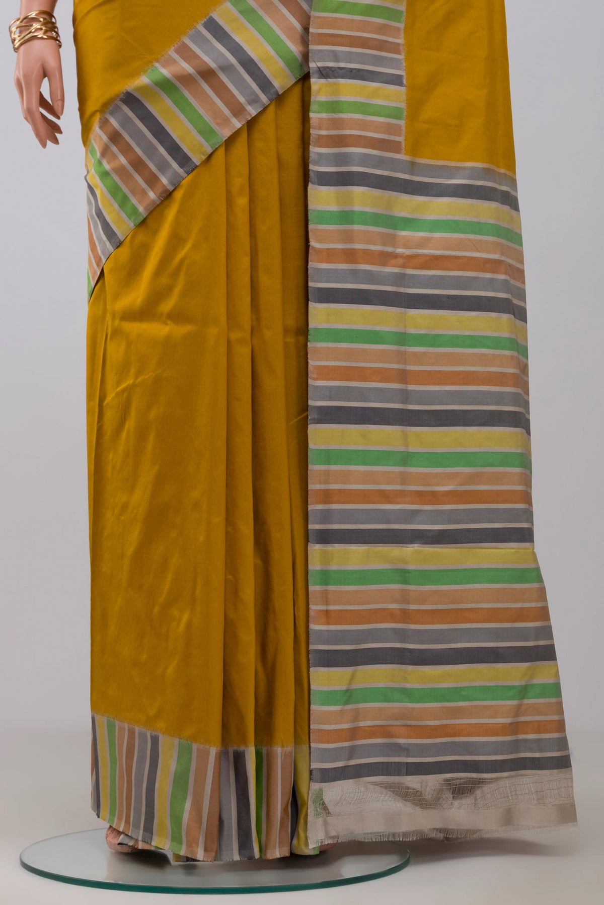 Pleats and pallu of Mustard Pochampally Silk Saree with Plain Body and Plain Border. 