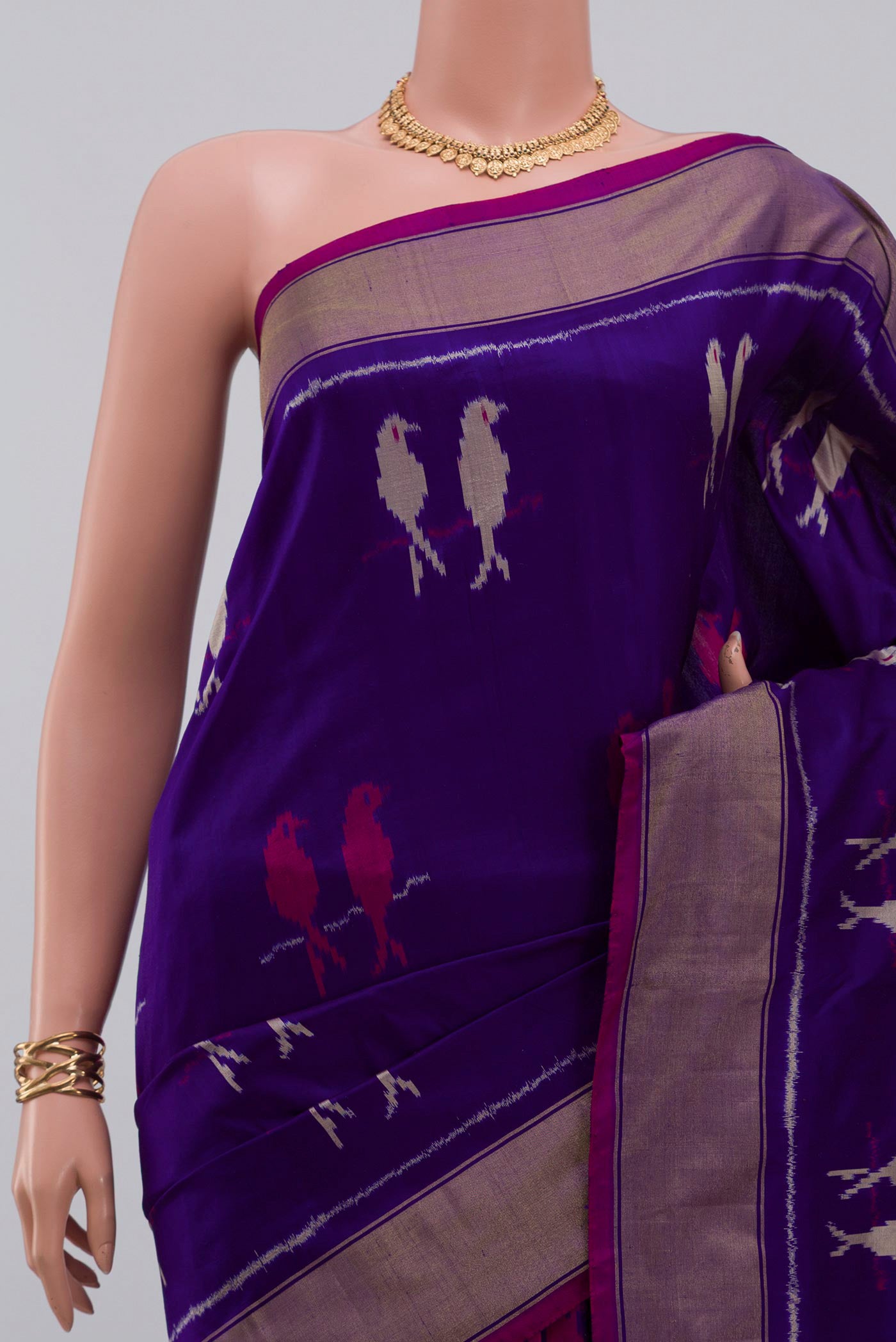 Border image of Purple Pochampally Saree with Ikat design on the body and Zari Border. 
