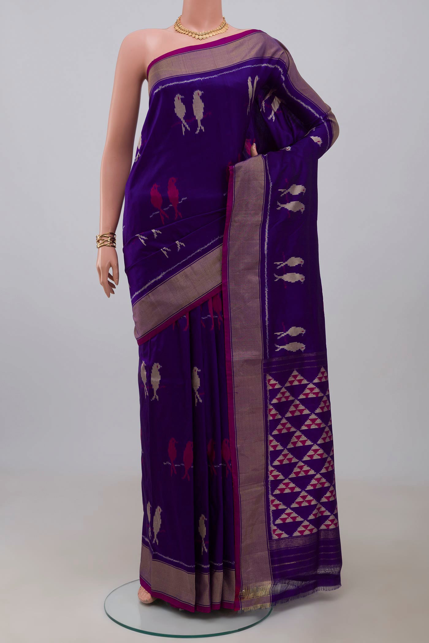 Purple Pochampally Saree with Ikat design on the body and Zari Border.  displayed on a mannequin