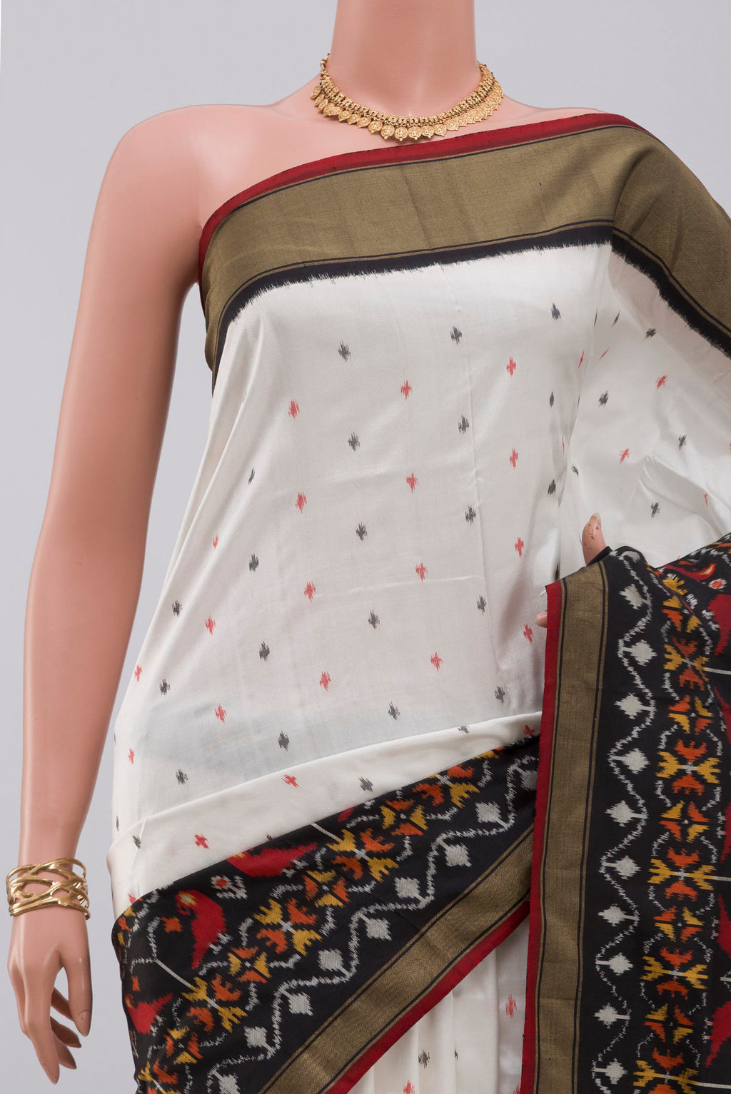 Border image of White Pochampally Saree with Ikat Print on the body and Ikat Border. 