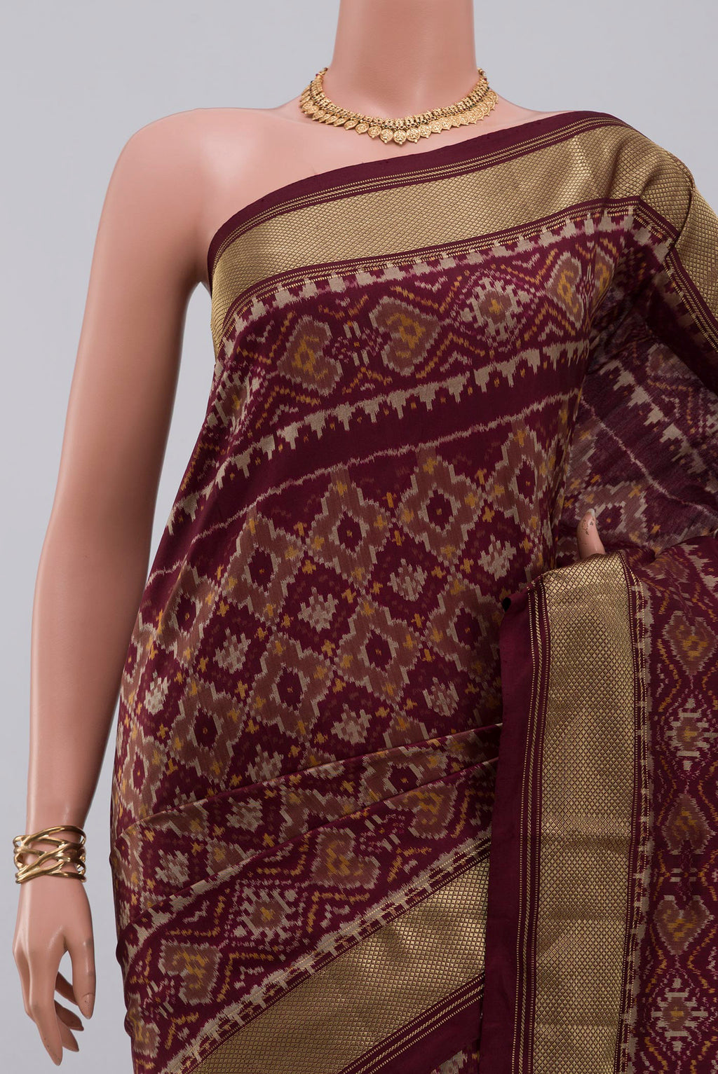 Border image of Coffee Brown Pochampally Saree with Ikat design on the body and Zari Border. 