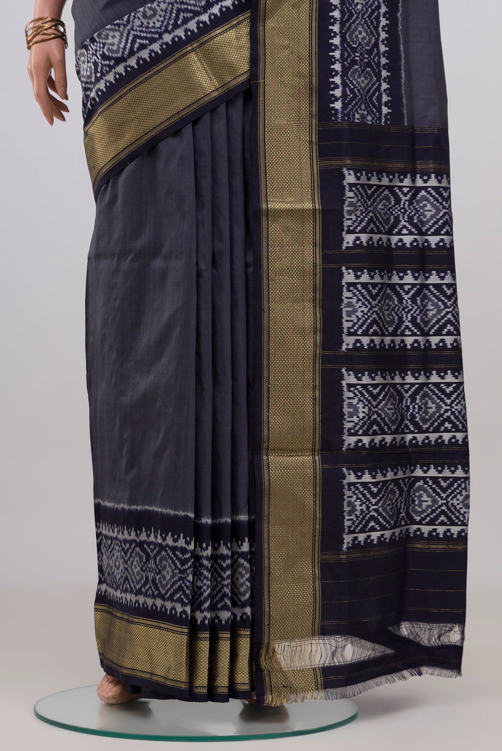 Pleats and pallu of Blue Grey Pochampally Silk Saree with Plain Body and Zari Border. 