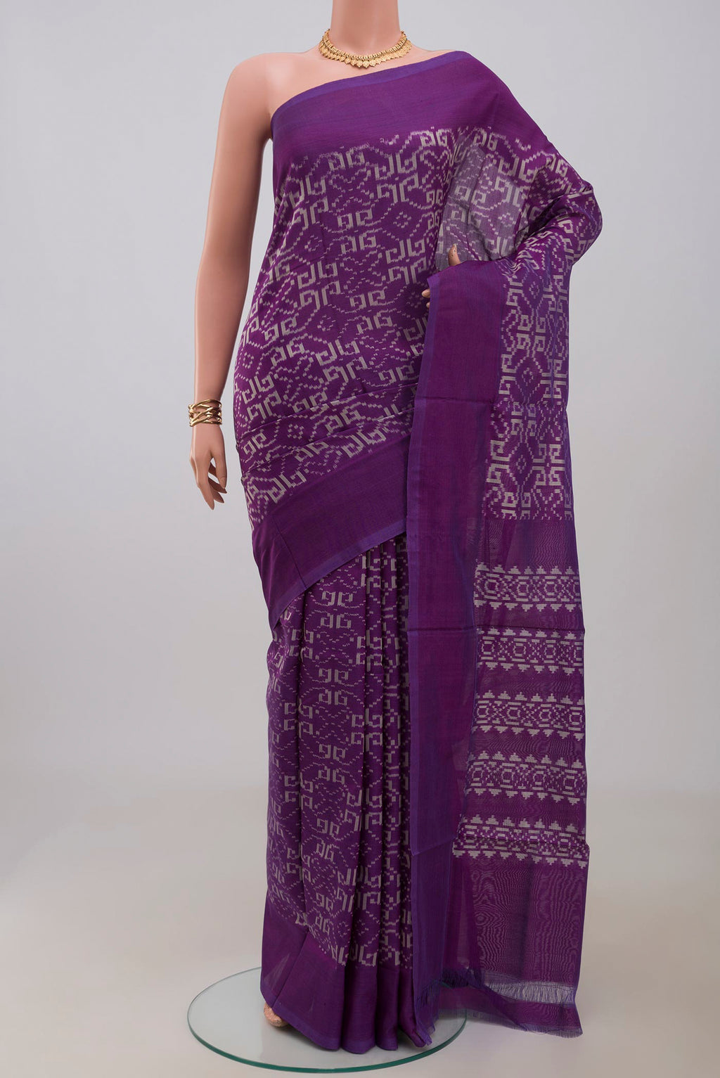 Pure Silk Pure Zari Purple Pochampally Saree with Ikat Print on the body and Plain Border.  displayed on a mannequin