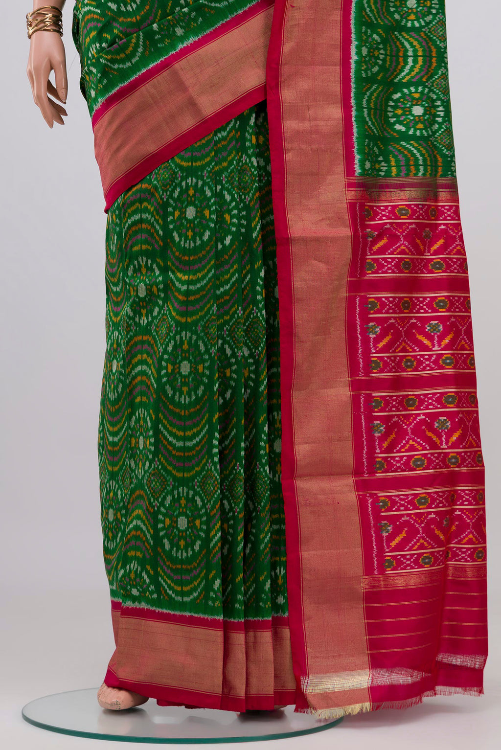 Pleats and pallu of Green Pochampally Silk Saree with Ikat design on the body and Zari Border. 