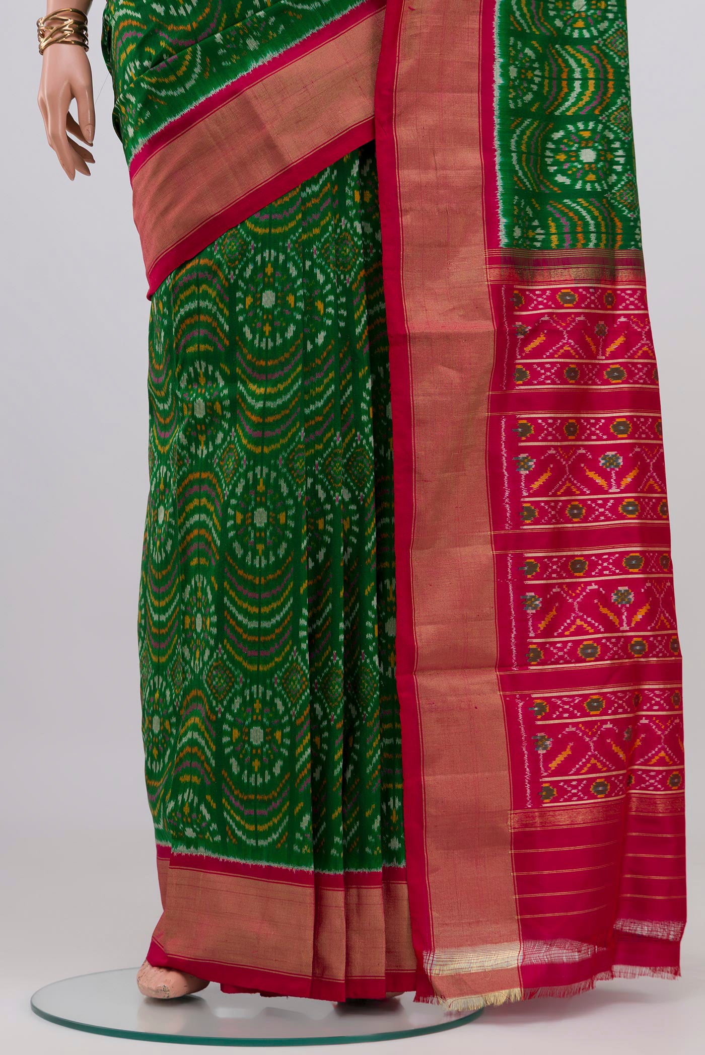 Pleats and pallu of Green Pochampally Silk Saree with Ikat design on the body and Zari Border. 