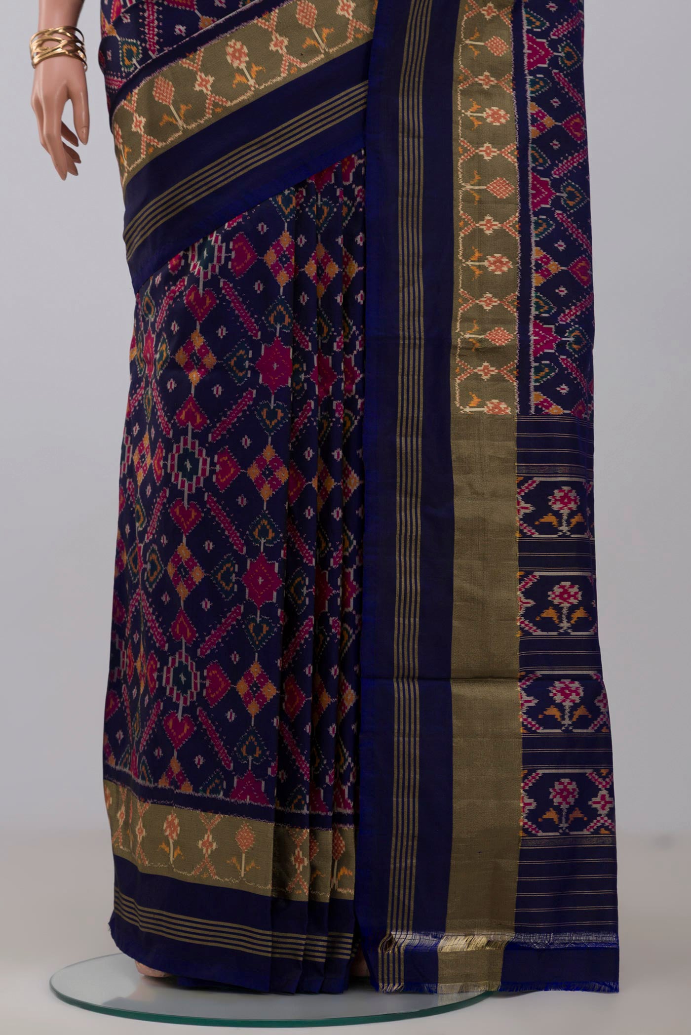 Pleats and pallu of Blue Pochampally Saree with Ikat Print on the body and Zari Border. 