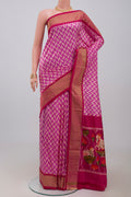 Pink Pochampally Silk Saree with Ikat design on the body and Zari Border.  displayed on a mannequin