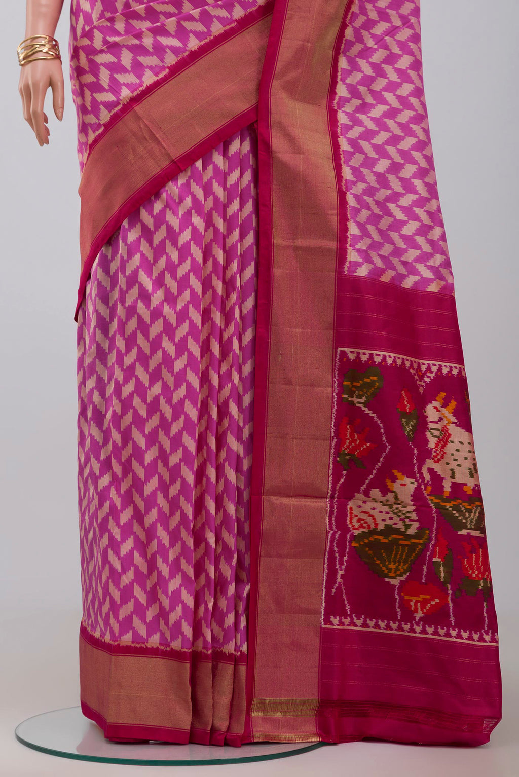 Pleats and pallu of Pink Pochampally Silk Saree with Ikat design on the body and Zari Border. 