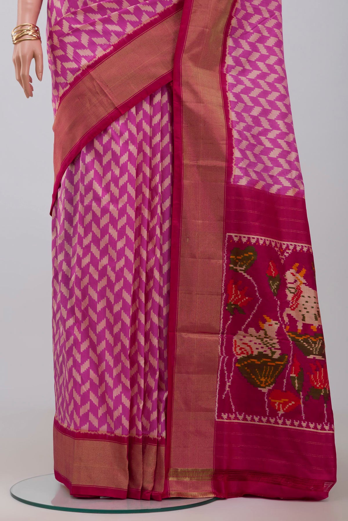 Pleats and pallu of Pink Pochampally Silk Saree with Ikat design on the body and Zari Border. 