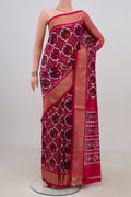 Pink Pochampally Saree with Ikat design on the body and Zari Border.  displayed on a mannequin