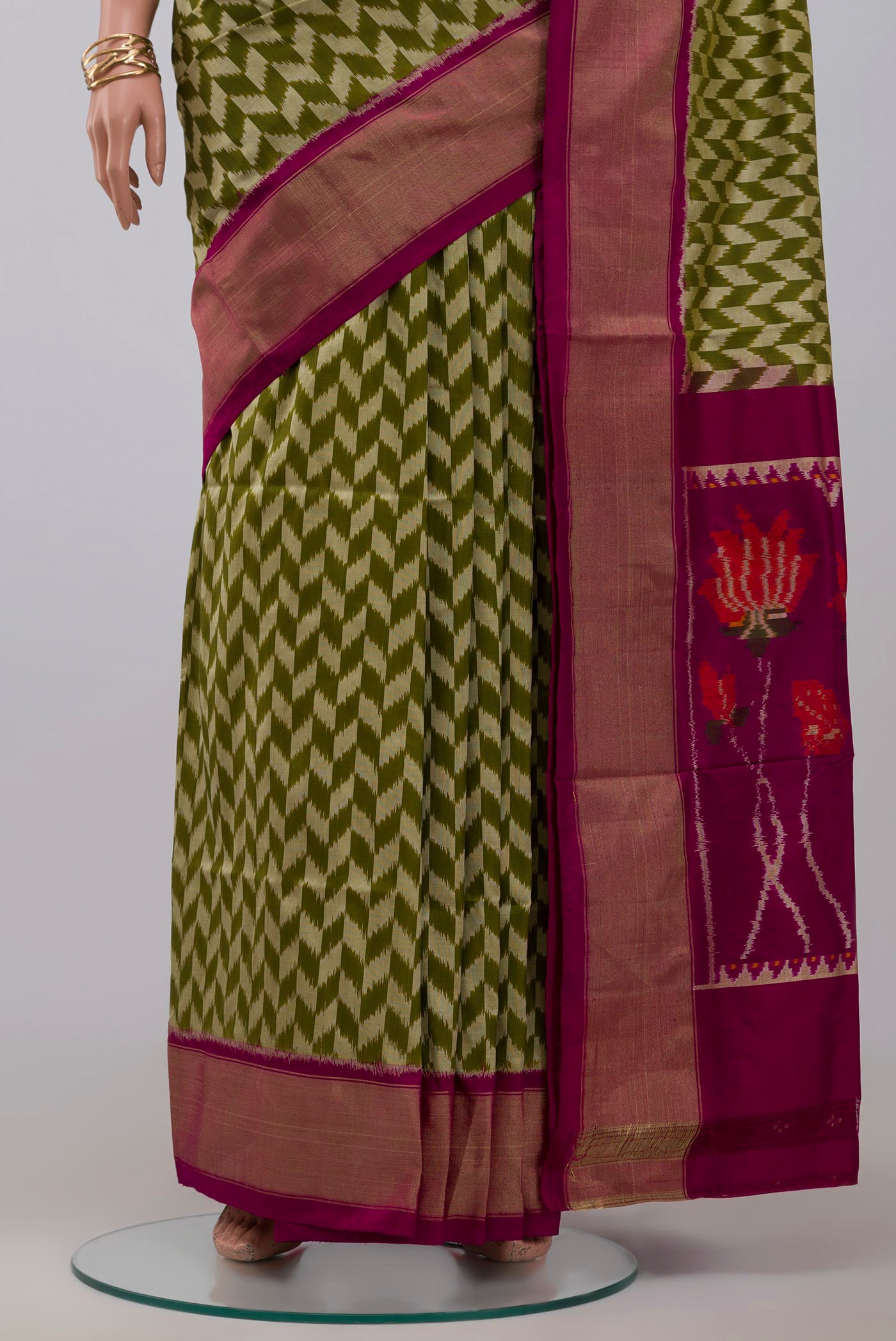 Pleats and pallu of Green Pochampally Silk Saree with Ikat design on the body and Zari Border. 