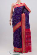 Dark Blue Pochampally Silk Saree with Ikat design on the body and Zari Border.  displayed on a mannequin
