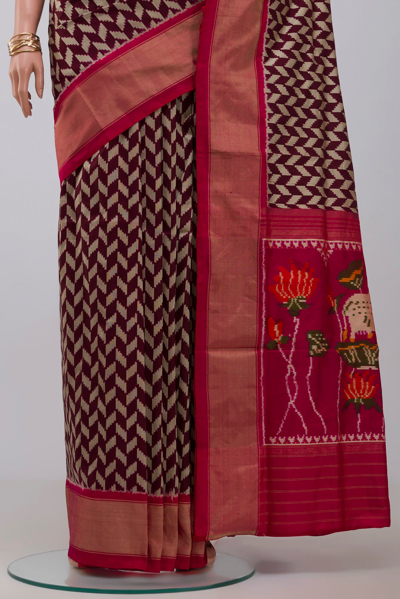Pleats and pallu of Brown Pochampally Silk Saree with Ikat design on the body and Zari Border. 